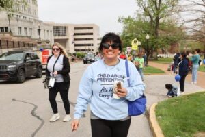 Woman wearing Child Abuse Prevention shirt