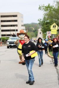 Texas Roadhouse employees walking in parade