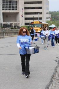 Woman handing stuff out at parade