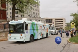 Missouri River Regional Library bus participating in parade