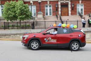 CMFCAA SUV driving in parade