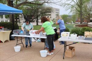 Volunteer preparing table for parade